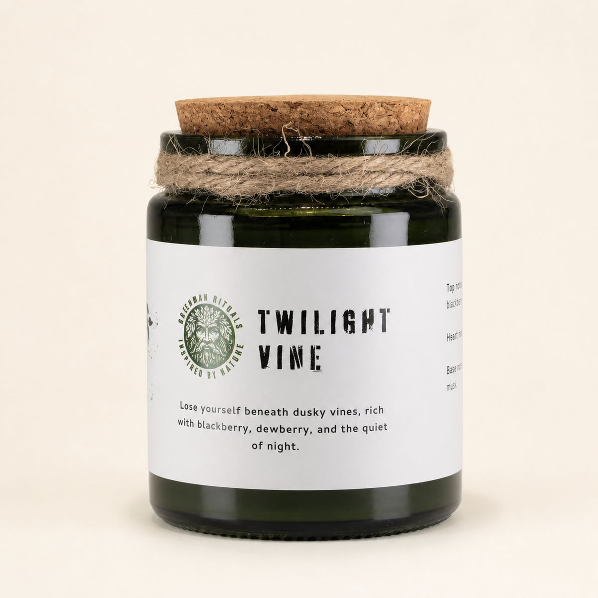 Twilight Vine woodwick soy candle in a green glass jar